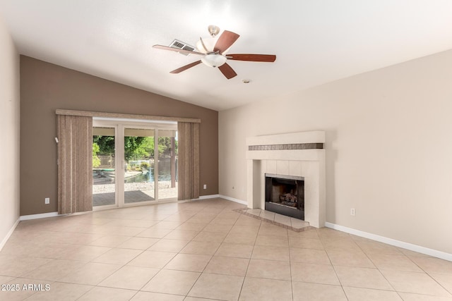 1379 E Butler Cir, Chandler, AZ 85225 - unfurnished living room featuring vaulted ceiling, ceiling fan, light tile patterned floors, and a tiled fireplace