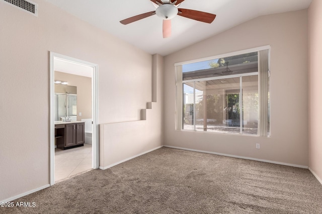 1379 E Butler Cir, Chandler, AZ 85225 - empty room with vaulted ceiling, light carpet, and a ceiling fan