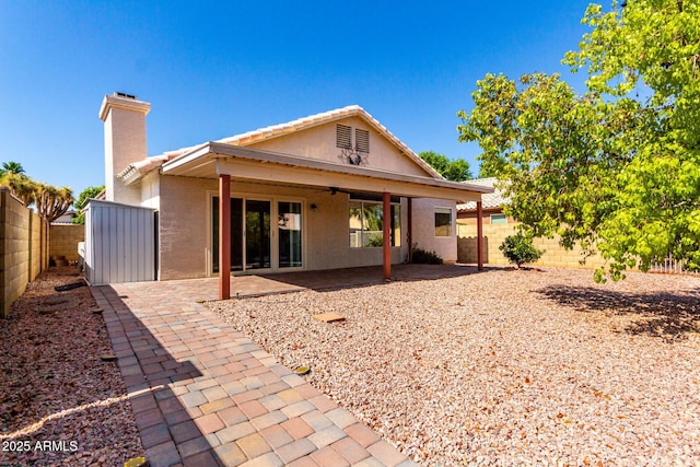 1379 E Butler Cir, Chandler, AZ 85225 - back of property featuring a fenced backyard, a ceiling fan, a patio, and stucco siding