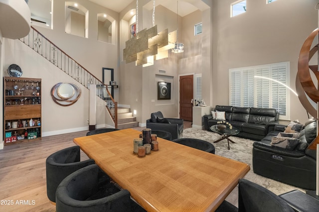 8447 W Tether Trl, Peoria, AZ 85383 - living area with a towering ceiling, wood finished floors, and stairway