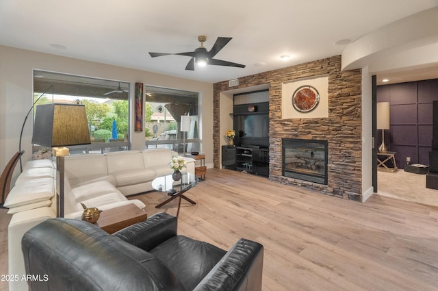 8447 W Tether Trl, Peoria, AZ 85383 - living area with a fireplace, wood finished floors, and ceiling fan