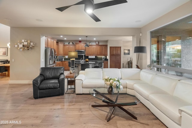 8447 W Tether Trl, Peoria, AZ 85383 - living room featuring a ceiling fan, light wood-type flooring, and recessed lighting