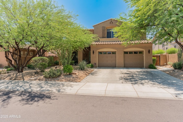 8447 W Tether Trl, Peoria, AZ 85383 - mediterranean / spanish-style house featuring a tiled roof, stucco siding, concrete driveway, and an attached garage