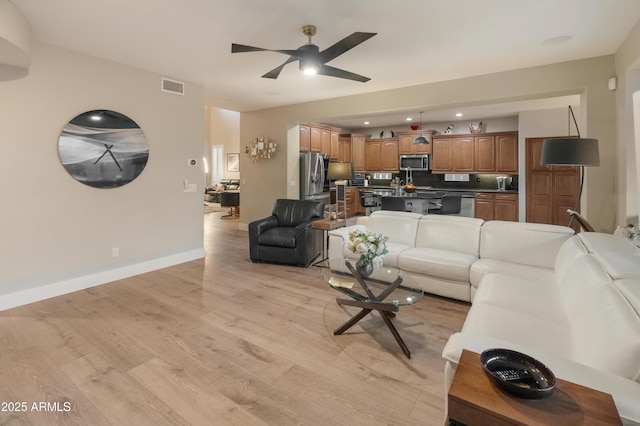 8447 W Tether Trl, Peoria, AZ 85383 - living room with a ceiling fan and light wood-style floors