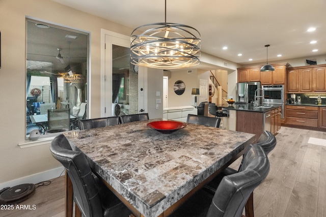 8447 W Tether Trl, Peoria, AZ 85383 - dining room with recessed lighting, a chandelier, and light wood-style floors