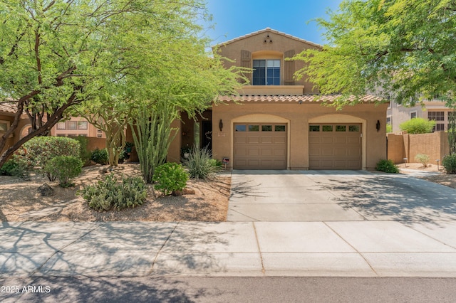 8447 W Tether Trl, Peoria, AZ 85383 - mediterranean / spanish-style house with concrete driveway, stucco siding, an attached garage, and a tiled roof