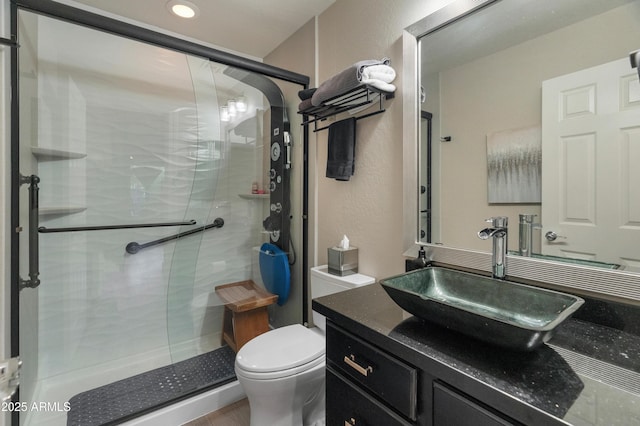 8447 W Tether Trl, Peoria, AZ 85383 - full bathroom with a stall shower, vanity, a textured wall, and recessed lighting