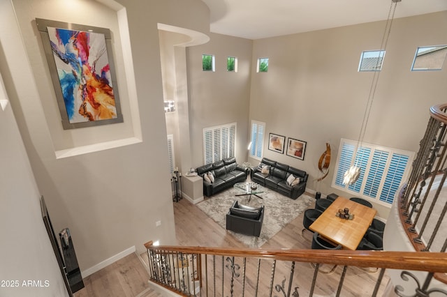8447 W Tether Trl, Peoria, AZ 85383 - living area with wood finished floors and a towering ceiling