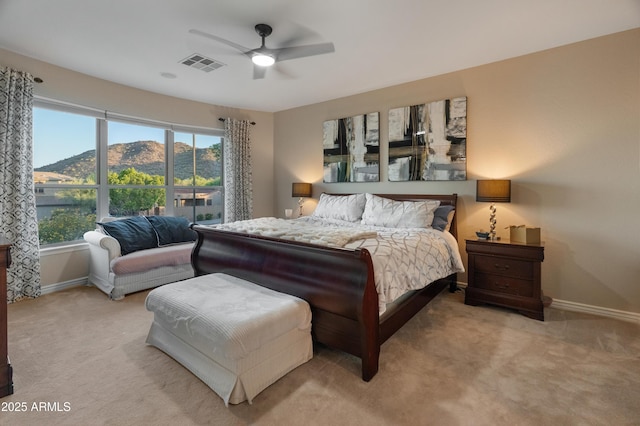 8447 W Tether Trl, Peoria, AZ 85383 - carpeted bedroom with a mountain view and a ceiling fan