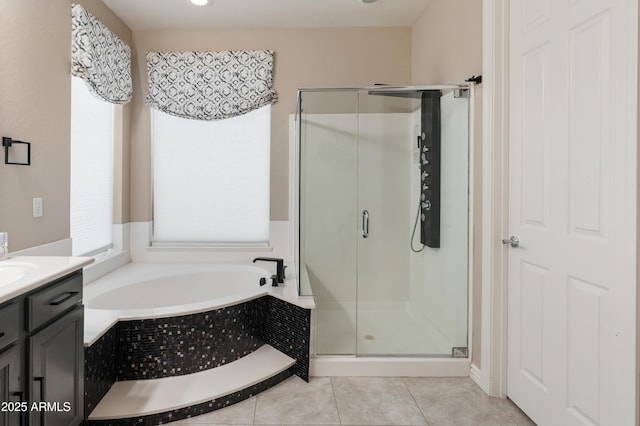 8447 W Tether Trl, Peoria, AZ 85383 - bathroom with a bath, a stall shower, vanity, and tile patterned flooring