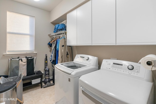 8447 W Tether Trl, Peoria, AZ 85383 - laundry area with washer and clothes dryer, cabinet space, and light tile patterned floors