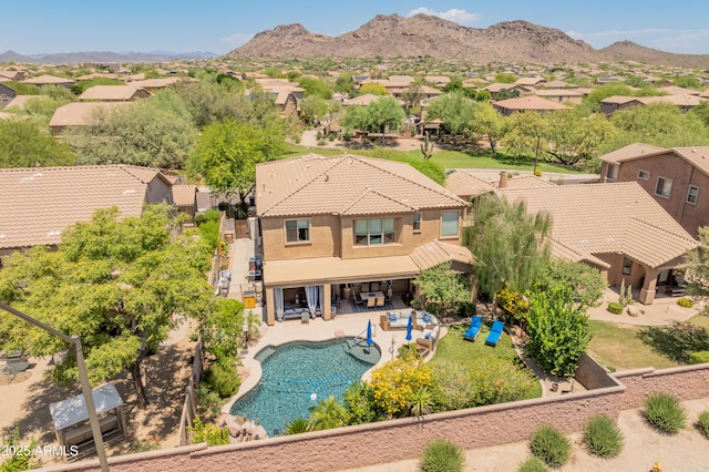 8447 W Tether Trl, Peoria, AZ 85383 - aerial perspective of suburban area with a pool area and a mountainous background