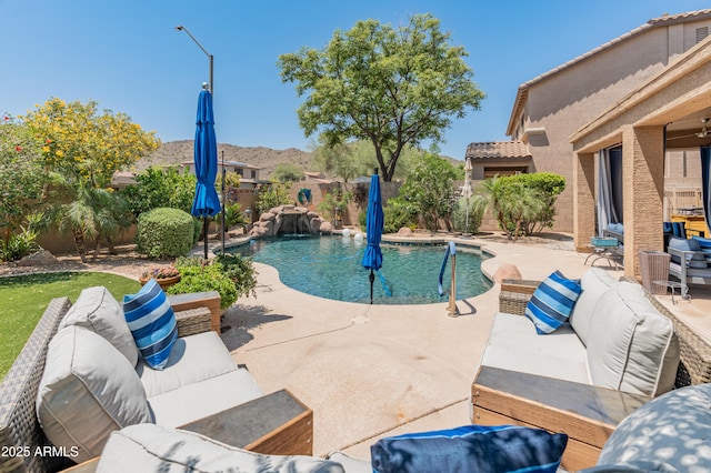 8447 W Tether Trl, Peoria, AZ 85383 - view of pool featuring outdoor lounge area, a fenced backyard, and a patio area