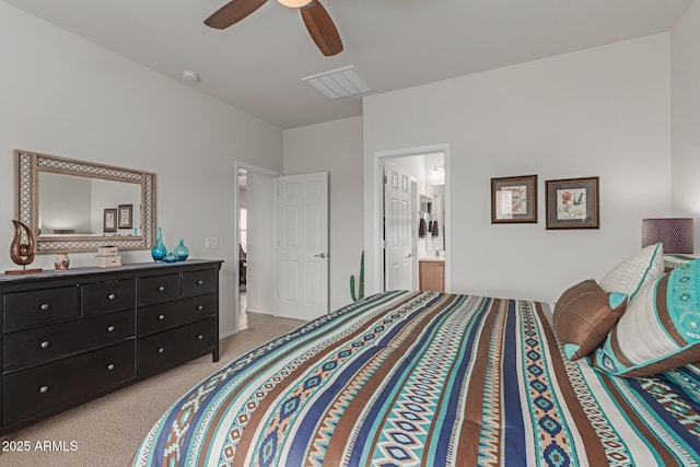 carpeted bedroom featuring ensuite bathroom and ceiling fan