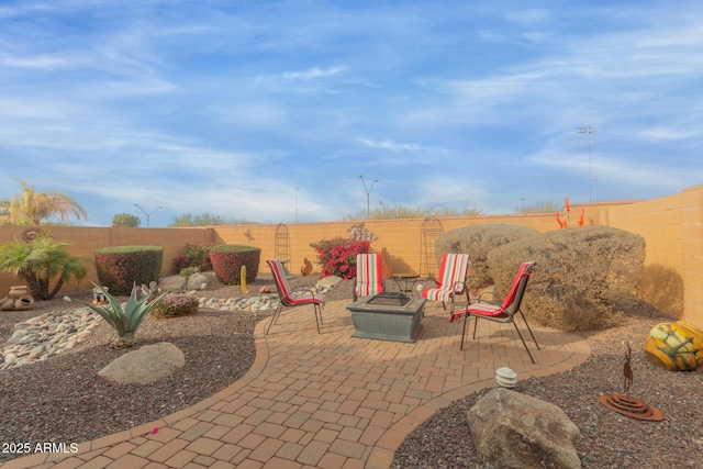 view of patio with an outdoor fire pit