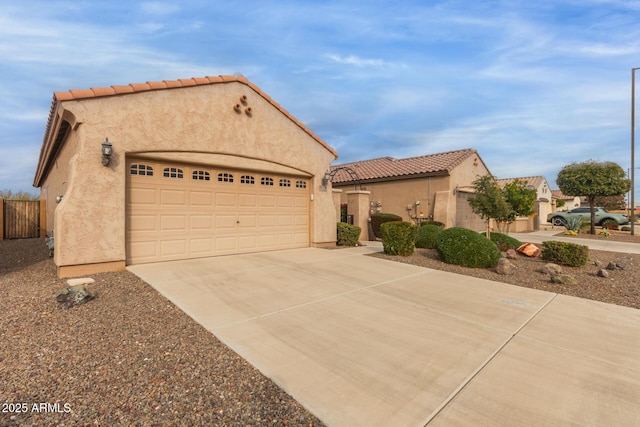 mediterranean / spanish-style home with a garage