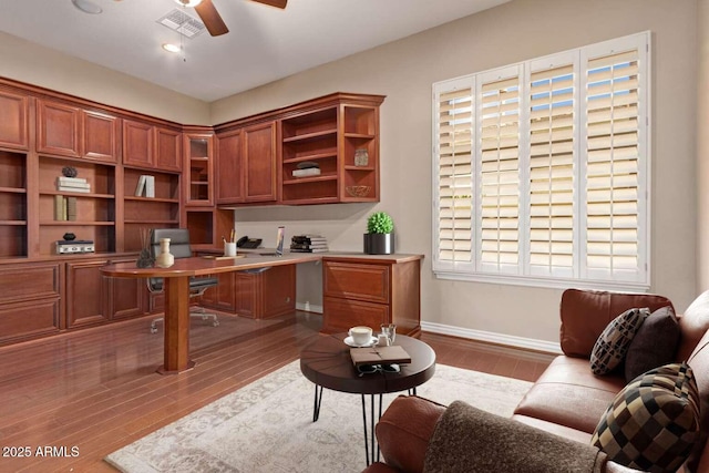 office area featuring ceiling fan, light wood-type flooring, and plenty of natural light