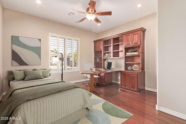 bedroom featuring ceiling fan and dark hardwood / wood-style flooring