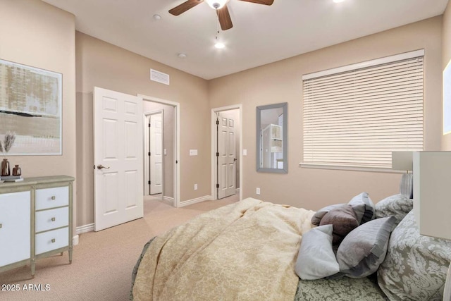 bedroom with ceiling fan and light colored carpet