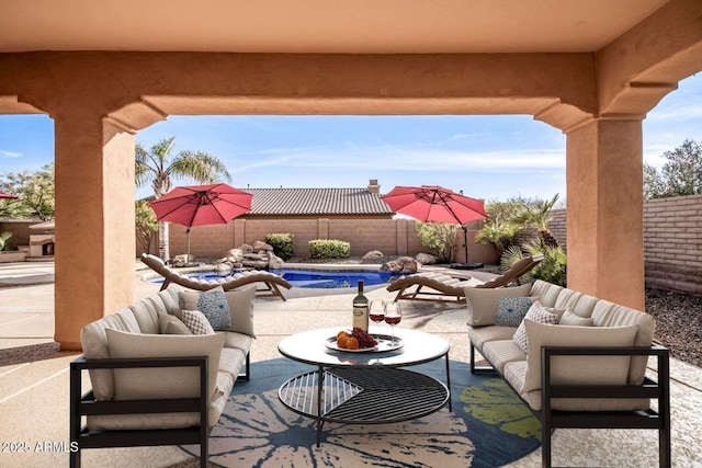 view of patio featuring outdoor lounge area and a fenced in pool