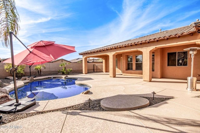 view of swimming pool with a patio area