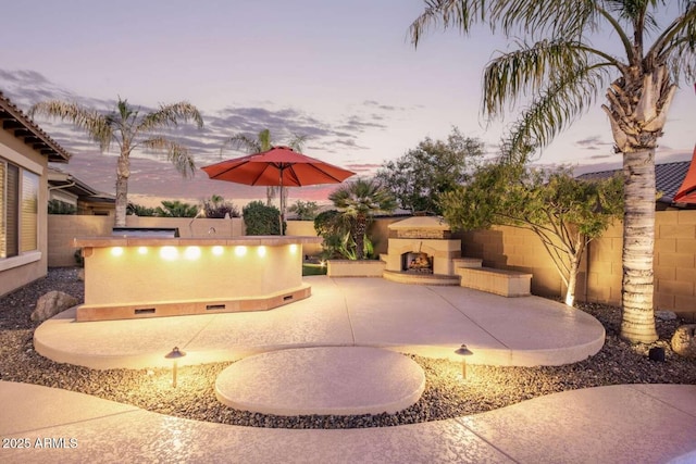 exterior space featuring an outdoor stone fireplace