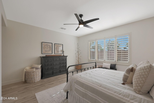 bedroom with ceiling fan and light wood-type flooring