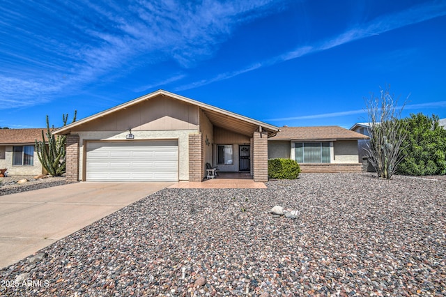 ranch-style house featuring a garage