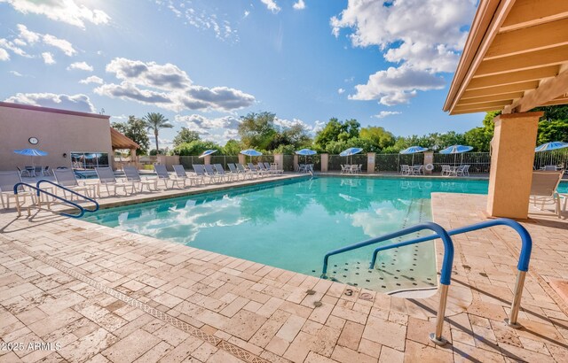 view of swimming pool featuring a patio area