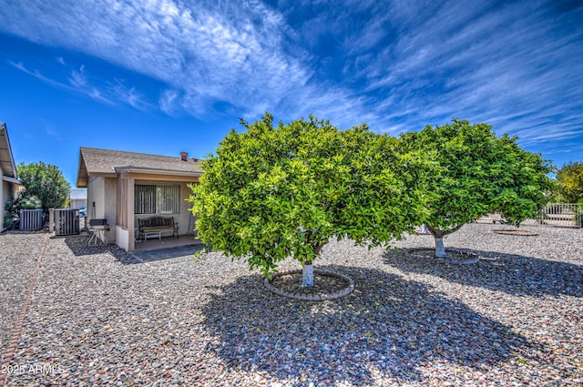 back of house featuring a patio area and central AC