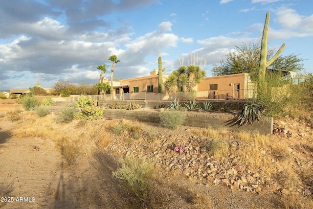 back of house with stucco siding