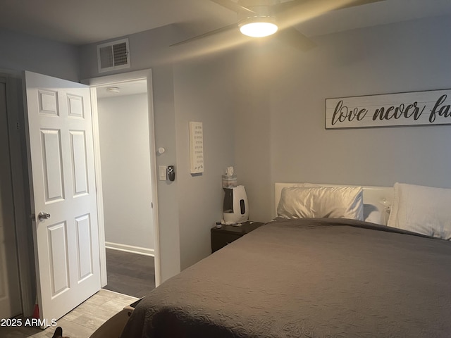 bedroom featuring hardwood / wood-style flooring and ceiling fan