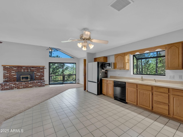 5130 Juniper Loop, Pine, AZ 85544 - kitchen featuring dishwasher, freestanding refrigerator, stainless steel microwave, plenty of natural light, and lofted ceiling