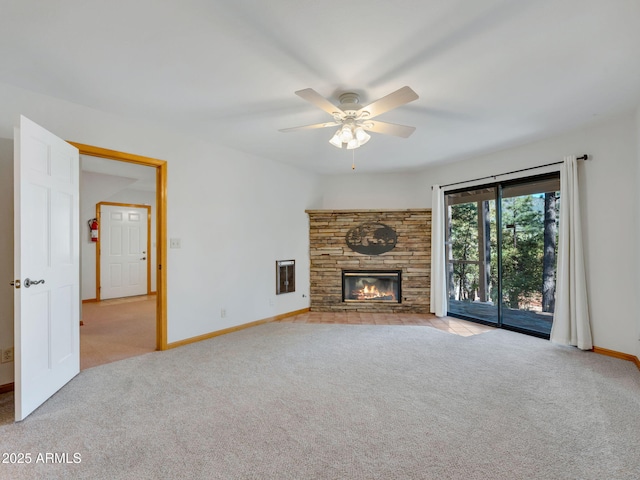 5130 Juniper Loop, Pine, AZ 85544 - unfurnished living room with carpet flooring, baseboards, a ceiling fan, and a fireplace