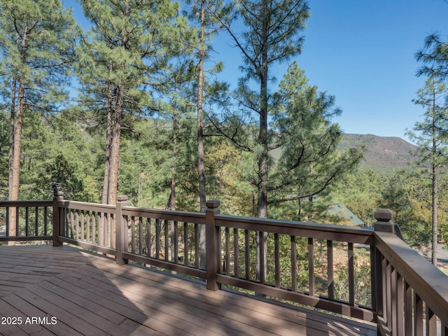 5130 Juniper Loop, Pine, AZ 85544 - deck featuring a wooded view and a mountain view