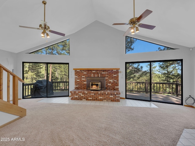 5130 Juniper Loop, Pine, AZ 85544 - unfurnished living room featuring a ceiling fan, high vaulted ceiling, carpet, tile patterned flooring, and a fireplace