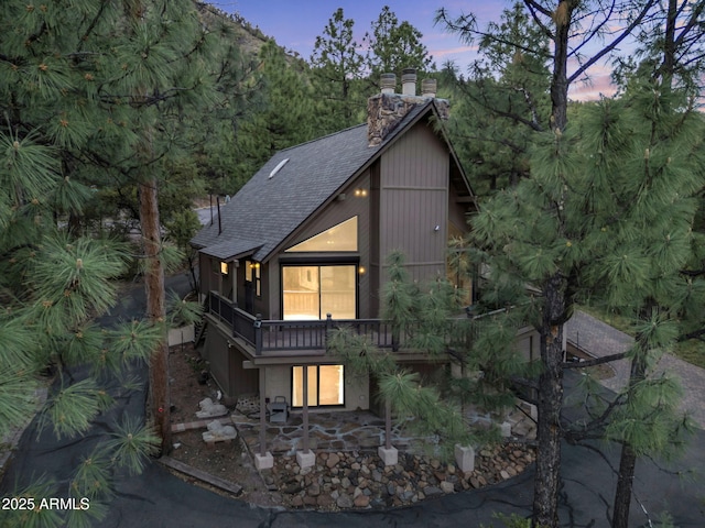 5130 Juniper Loop, Pine, AZ 85544 - view of front of property featuring roof with shingles, a chimney, and a patio area