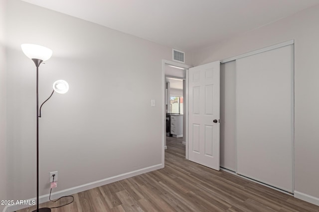 3812 W Seldon Ln, Phoenix, AZ 85051 - unfurnished bedroom with wood finished floors and a closet