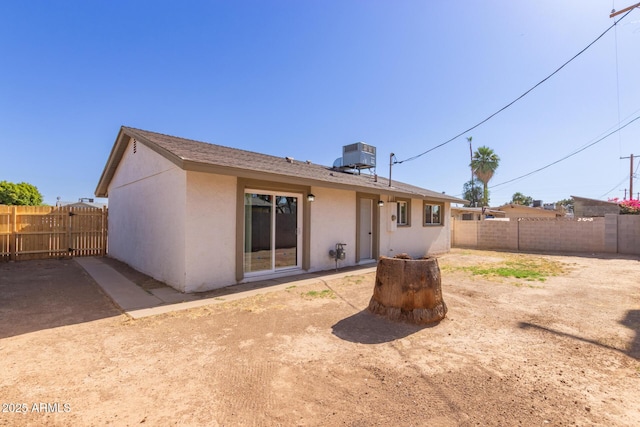 3812 W Seldon Ln, Phoenix, AZ 85051 - rear view of house with stucco siding and a fenced backyard