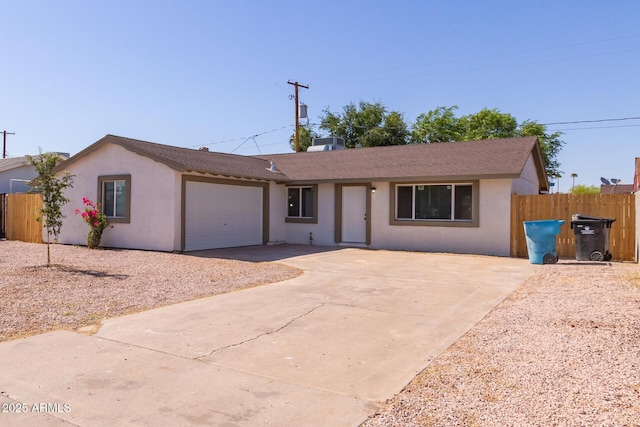 3812 W Seldon Ln, Phoenix, AZ 85051 - ranch-style home with a garage, concrete driveway, stucco siding, and roof with shingles