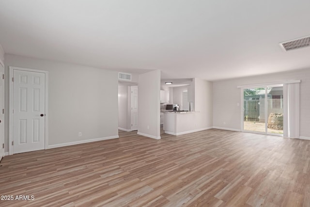 3812 W Seldon Ln, Phoenix, AZ 85051 - unfurnished living room featuring light wood-style floors