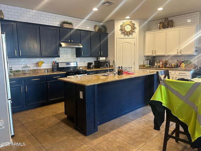 23644 S 209th Pl, Queen Creek, AZ 85142 - kitchen with stainless steel appliances, under cabinet range hood, tasteful backsplash, light stone counters, and recessed lighting