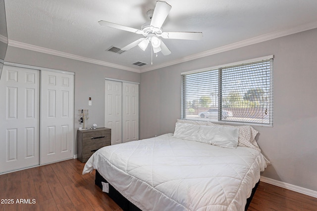 3408 W Carol Ave, Phoenix, AZ 85051 - bedroom with visible vents, wood finished floors, baseboards, multiple closets, and ornamental molding
