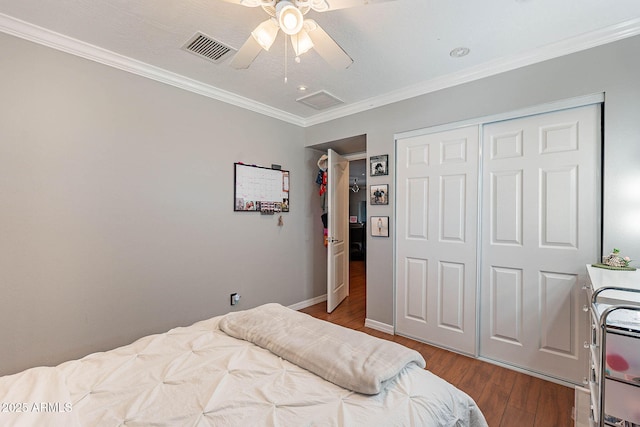 3408 W Carol Ave, Phoenix, AZ 85051 - bedroom with visible vents, crown molding, a closet, ceiling fan, and dark wood-style floors