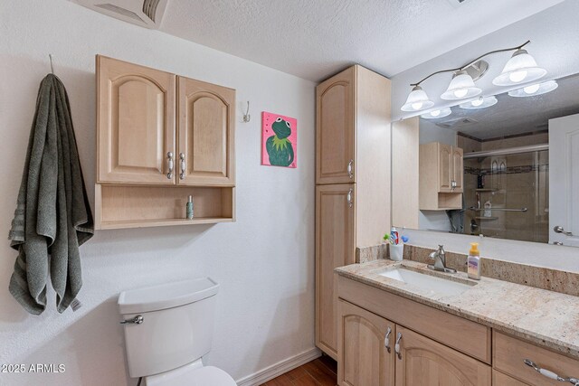 3408 W Carol Ave, Phoenix, AZ 85051 - bathroom featuring visible vents, a shower stall, wood finished floors, vanity, and toilet