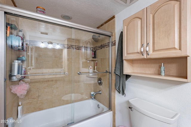 3408 W Carol Ave, Phoenix, AZ 85051 - full bathroom featuring visible vents, bath / shower combo with glass door, a textured ceiling, and toilet