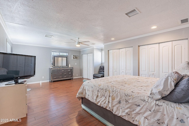 3408 W Carol Ave, Phoenix, AZ 85051 - bedroom featuring crown molding, a textured ceiling, and visible vents