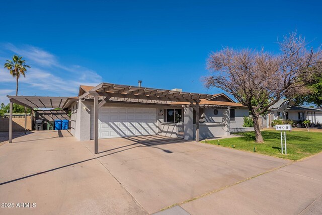 3408 W Carol Ave, Phoenix, AZ 85051 - ranch-style house featuring driveway, a garage, a front lawn, a pergola, and stucco siding