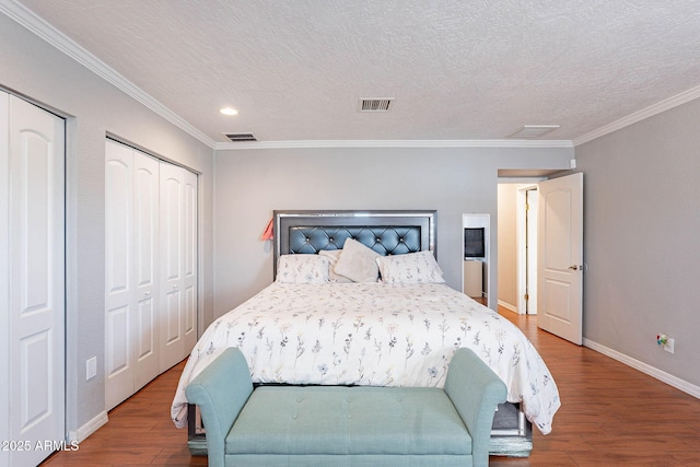 3408 W Carol Ave, Phoenix, AZ 85051 - bedroom featuring crown molding, baseboards, wood finished floors, and visible vents