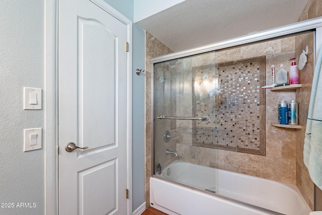 3408 W Carol Ave, Phoenix, AZ 85051 - bathroom with bath / shower combo with glass door and a textured ceiling